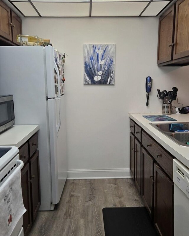 14015 James Dr Unit 523, Crestwood, IL 60418 - kitchen featuring white appliances, dark wood-style floors, light countertops, and baseboards