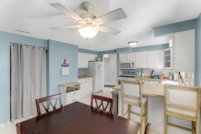 4730 N Hermitage Ave Unit 2F, Chicago, IL 60640 - dining area with ceiling fan and light tile patterned floors