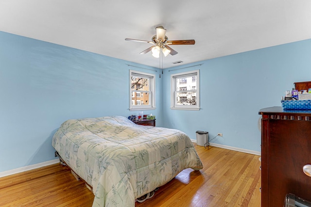4730 N Hermitage Ave Unit 2F, Chicago, IL 60640 - bedroom featuring light wood-style floors, baseboards, and a ceiling fan