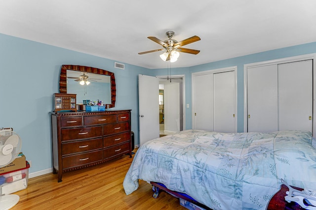 4730 N Hermitage Ave Unit 2F, Chicago, IL 60640 - bedroom with light wood-type flooring, multiple closets, ceiling fan, and baseboards