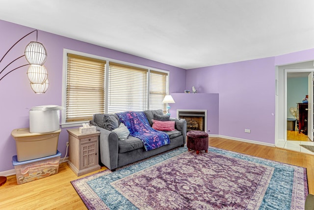 4730 N Hermitage Ave Unit 2F, Chicago, IL 60640 - living area featuring wood finished floors, a fireplace, and baseboards