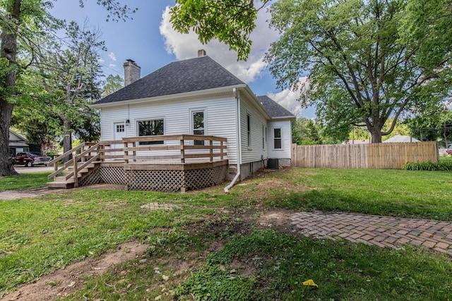324 W Sumner St, Streator, IL 61364 - rear view of property with a chimney, a wooden deck, roof with shingles, and central air condition unit