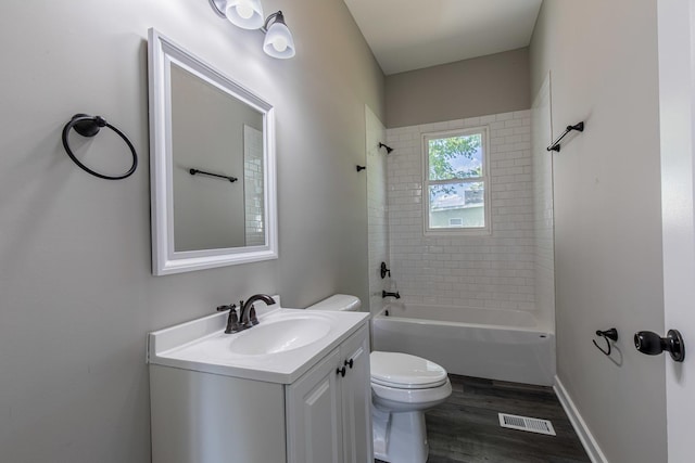 324 W Sumner St, Streator, IL 61364 - full bathroom featuring vanity, toilet, wood finished floors, and shower / bathtub combination