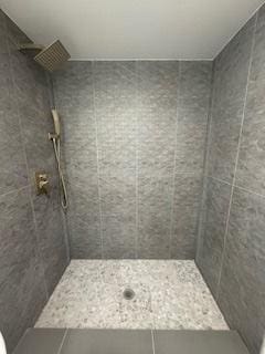 9536 S Woodlawn Ave, Chicago, IL 60628 - full bathroom with tiled shower and tile patterned flooring