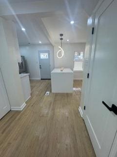 9536 S Woodlawn Ave, Chicago, IL 60628 - hall featuring light wood-style flooring, baseboards, and recessed lighting