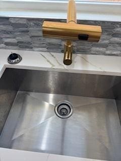 9536 S Woodlawn Ave, Chicago, IL 60628 - kitchen view of decorative backsplash and a sink