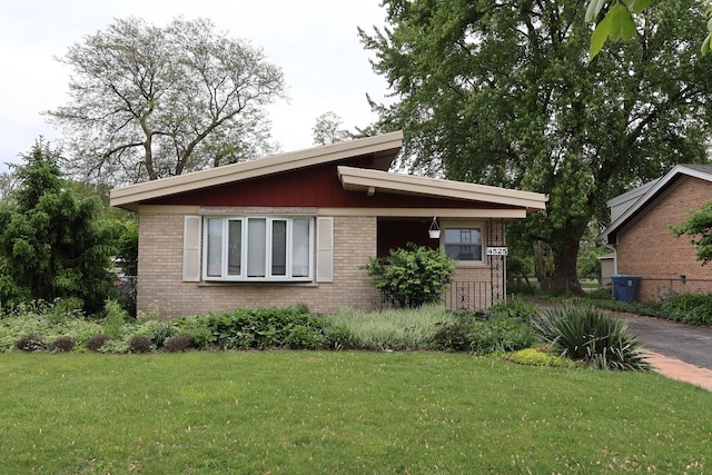 4525 W 125th St, Alsip, IL 60803 - view of front of property with brick siding and a front yard