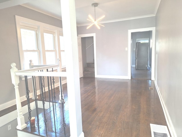 8732 S Laflin St, Chicago, IL 60620 - hall featuring dark wood-style flooring, baseboards, an upstairs landing, and crown molding