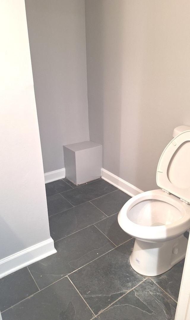 8732 S Laflin St, Chicago, IL 60620 - bathroom with toilet, baseboards, and tile patterned flooring