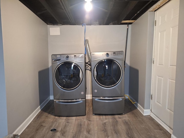 8732 S Laflin St, Chicago, IL 60620 - laundry area with separate washer and dryer, wood finished floors, and baseboards