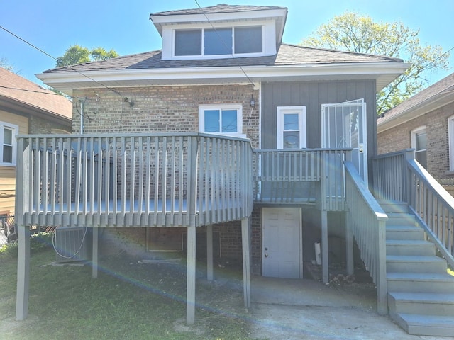 8732 S Laflin St, Chicago, IL 60620 - back of property featuring brick siding, roof with shingles, a deck, and central AC