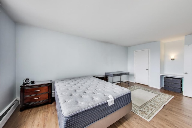 6325 N Sheridan Rd Unit 608, Chicago, IL 60660 - bedroom featuring baseboard heating and light wood finished floors