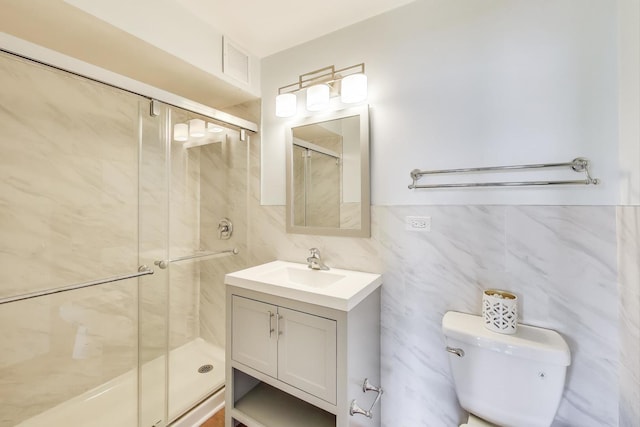 6325 N Sheridan Rd Unit 608, Chicago, IL 60660 - bathroom with a shower stall, toilet, vanity, tile walls, and tasteful backsplash