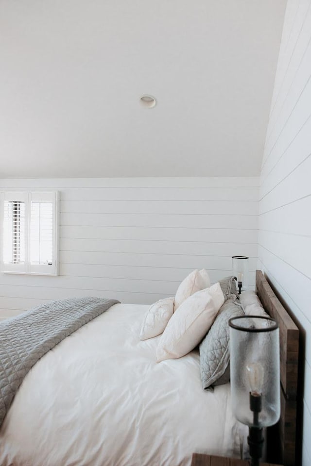 281 Snipe Hollow Rd N, Elizabeth, IL 61028 - bedroom featuring wooden walls and vaulted ceiling