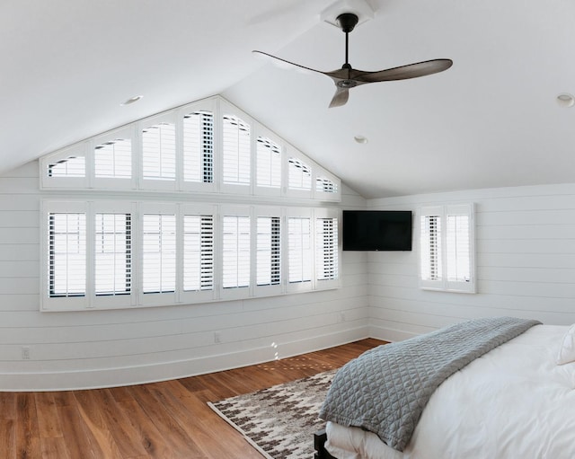 281 Snipe Hollow Rd N, Elizabeth, IL 61028 - bedroom featuring vaulted ceiling, wooden walls, wood finished floors, and ceiling fan