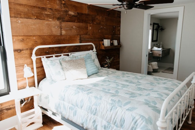 281 Snipe Hollow Rd N, Elizabeth, IL 61028 - bedroom with ensuite bathroom, wood walls, and a ceiling fan