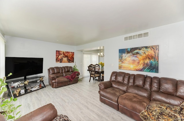 7 Fernwood Dr Unit Q, Bolingbrook, IL 60440 - living area featuring wood finished floors and a chandelier