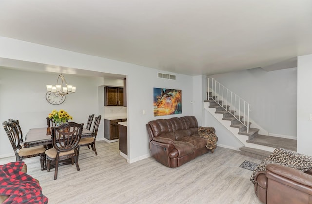 7 Fernwood Dr Unit Q, Bolingbrook, IL 60440 - living room featuring light wood-type flooring, a chandelier, stairway, and baseboards