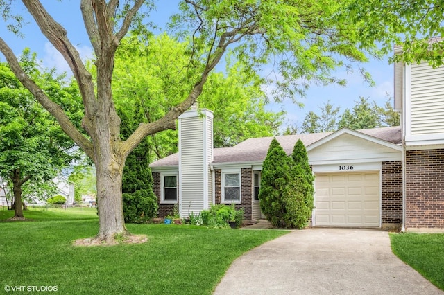1036 Colony Lake Dr Unit 0, Schaumburg, IL 60194 - view of front of house featuring brick siding, a chimney, an attached garage, driveway, and a front lawn