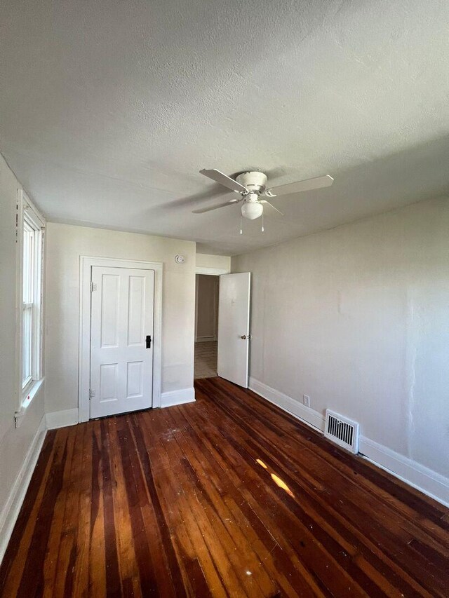 360 S Washington Ave, Kankakee, IL 60901 - unfurnished bedroom featuring hardwood / wood-style floors, a textured ceiling, and ceiling fan