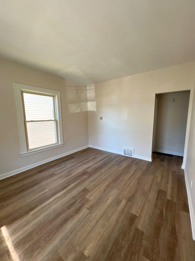 363 E Hickory St, Kankakee, IL 60901 - unfurnished room with dark wood-type flooring and baseboards