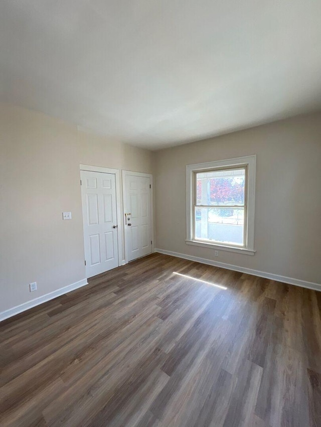 363 E Hickory St, Kankakee, IL 60901 - unfurnished room with dark wood-type flooring and baseboards