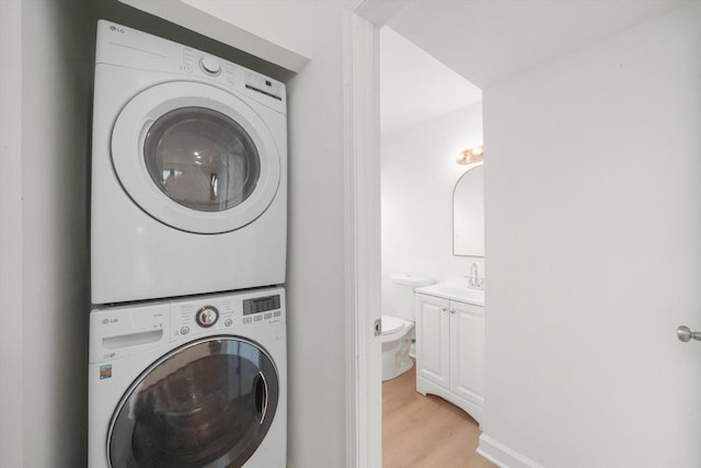 163 Queenswood Rd, Bolingbrook, IL 60440 - laundry room with stacked washer / drying machine and light wood finished floors