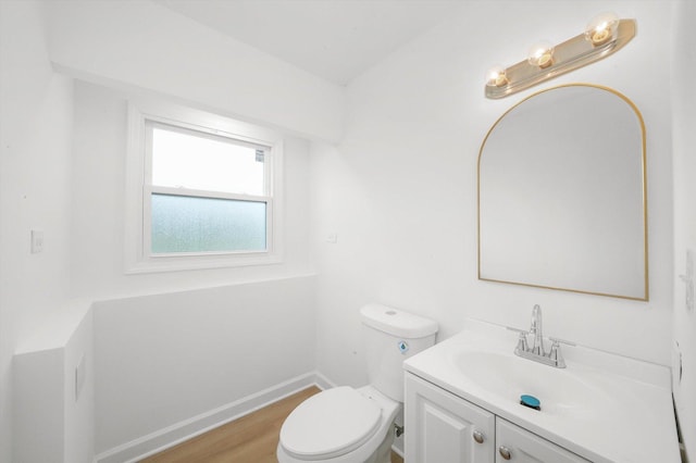 163 Queenswood Rd, Bolingbrook, IL 60440 - bathroom featuring vanity, toilet, wood finished floors, and baseboards