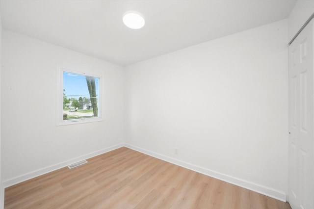 163 Queenswood Rd, Bolingbrook, IL 60440 - unfurnished bedroom with light wood-style flooring, baseboards, and a closet