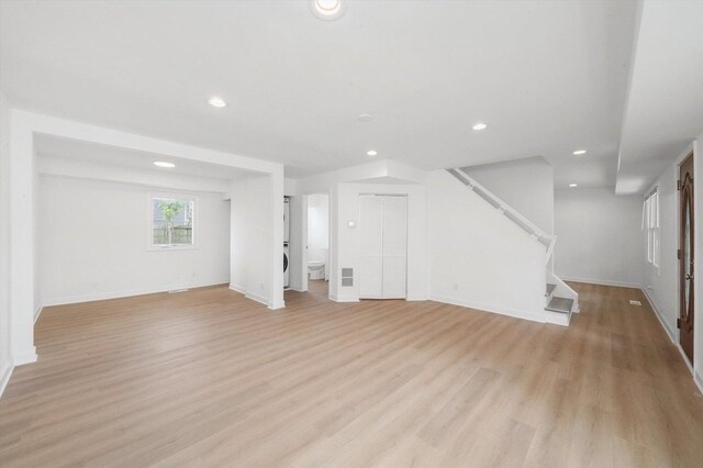 163 Queenswood Rd, Bolingbrook, IL 60440 - unfurnished living room featuring light wood-style flooring, recessed lighting, stairway, and baseboards