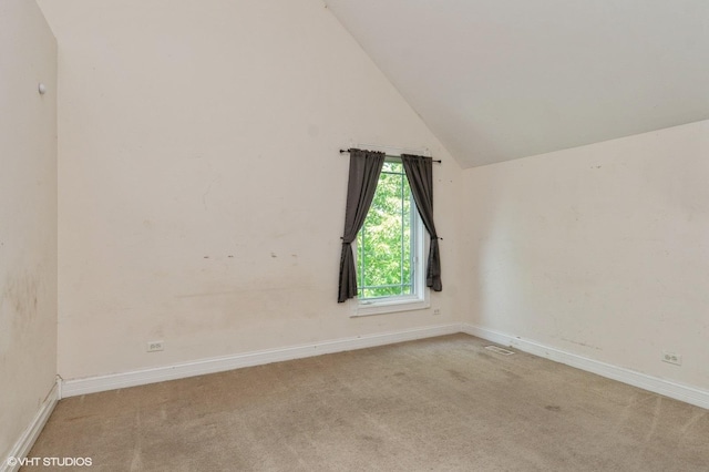 4722 Douglas Rd, Oswego, IL 60543 - carpeted empty room featuring vaulted ceiling and baseboards