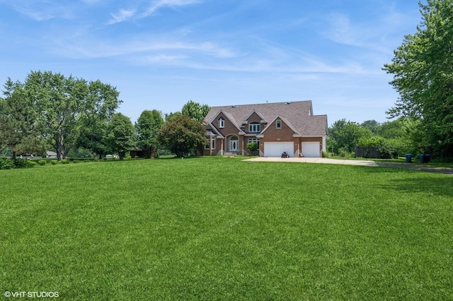 4722 Douglas Rd, Oswego, IL 60543 - view of front of house with concrete driveway, an attached garage, and a front lawn