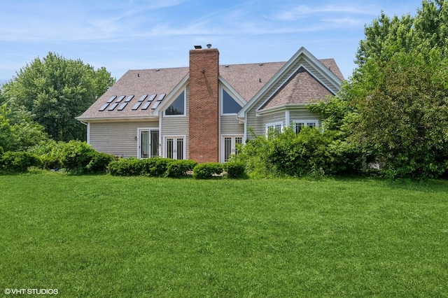 4722 Douglas Rd, Oswego, IL 60543 - back of property with a lawn, a shingled roof, and a chimney