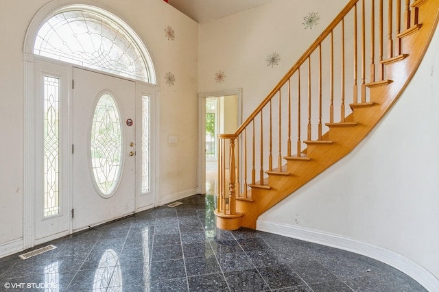 4722 Douglas Rd, Oswego, IL 60543 - entrance foyer featuring granite tiled floors, baseboards, stairway, and a high ceiling