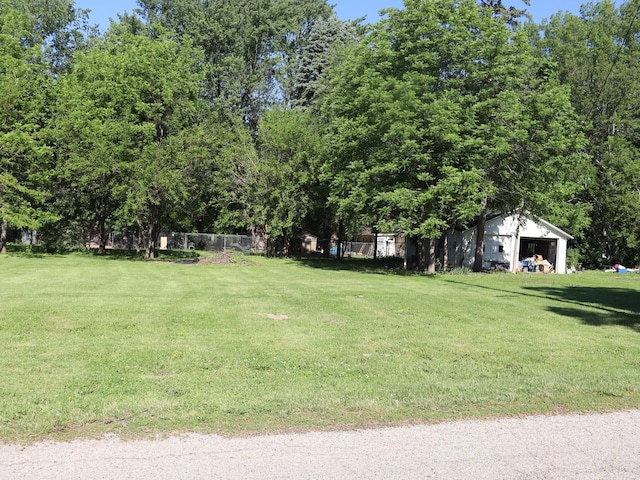 201 W 3rd St, Streator, IL 61364 - view of grassy yard featuring an outdoor structure, a garage, and an outbuilding