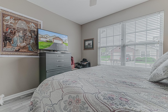 303 Capitol Dr Unit A, Sugar Grove, IL 60554 - bedroom featuring light wood-style floors, baseboards, and ceiling fan