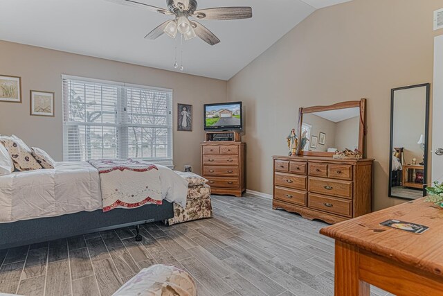 303 Capitol Dr Unit A, Sugar Grove, IL 60554 - bedroom with lofted ceiling, light wood-style flooring, a ceiling fan, and baseboards