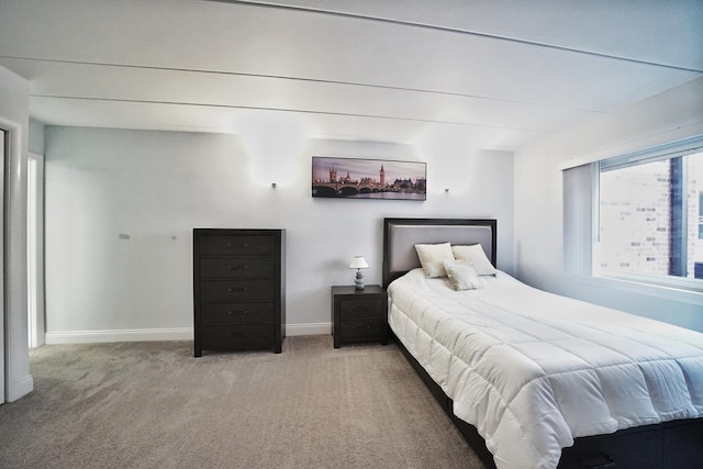 603 S River Rd Unit 2K, Des Plaines, IL 60016 - bedroom with light colored carpet and baseboards
