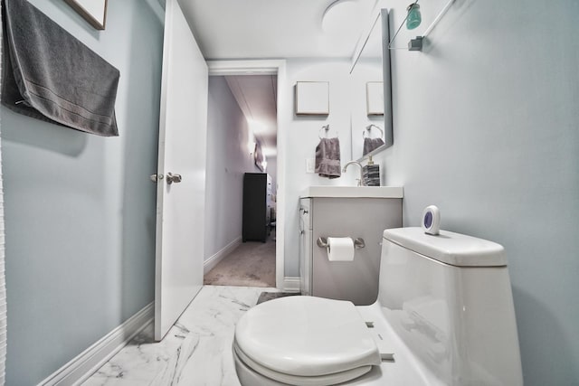 603 S River Rd Unit 2K, Des Plaines, IL 60016 - bathroom featuring toilet, baseboards, vanity, and marble look tile flooring