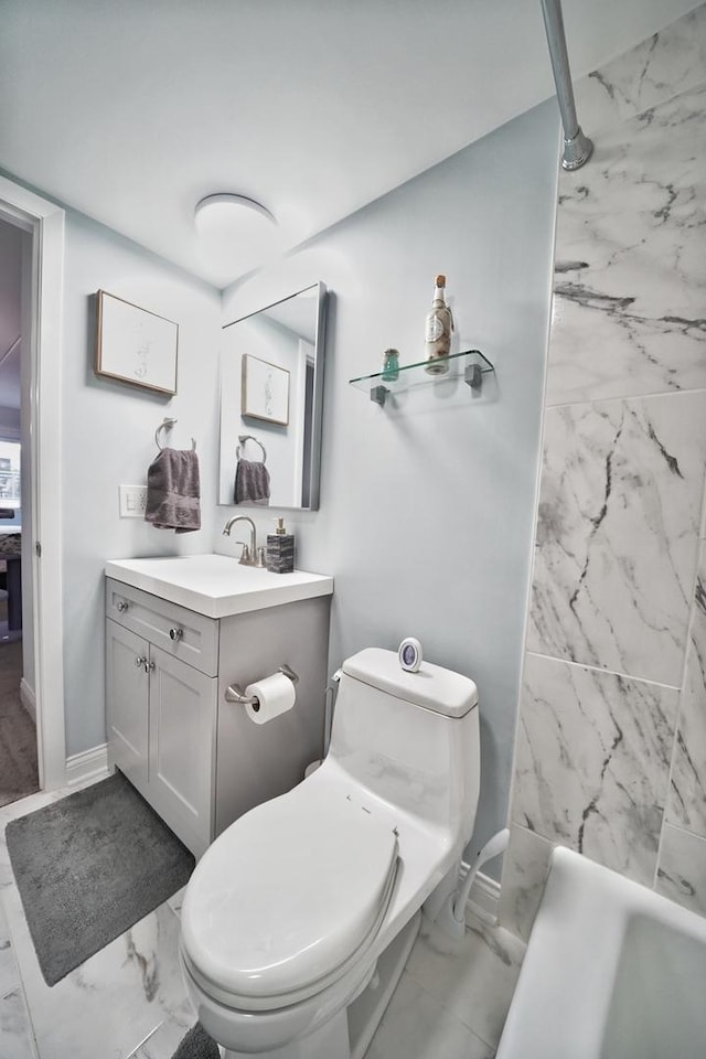 603 S River Rd Unit 2K, Des Plaines, IL 60016 - full bathroom with marble look tile flooring, vanity, toilet, and baseboards