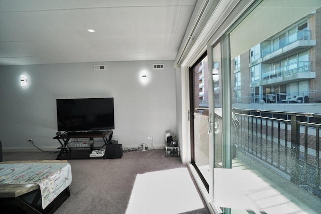 603 S River Rd Unit 2K, Des Plaines, IL 60016 - living room featuring carpet floors and baseboards
