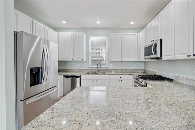 2847 N Wolcott Ave Unit D, Chicago, IL 60657 - kitchen with stainless steel appliances, a sink, light stone counters, white cabinetry, and recessed lighting