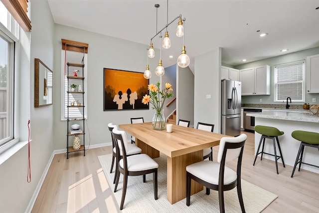 2847 N Wolcott Ave Unit D, Chicago, IL 60657 - dining area featuring light wood finished floors, recessed lighting, stairs, and baseboards