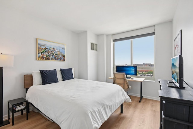 1111 S Wabash Ave Unit 1410, Chicago, IL 60605 - bedroom featuring light wood finished floors, baseboards, and an office area