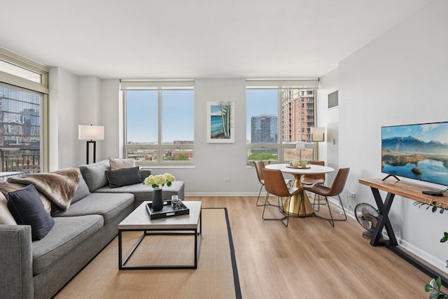 1111 S Wabash Ave Unit 1410, Chicago, IL 60605 - living room with wood finished floors, healthy amount of natural light, and baseboards