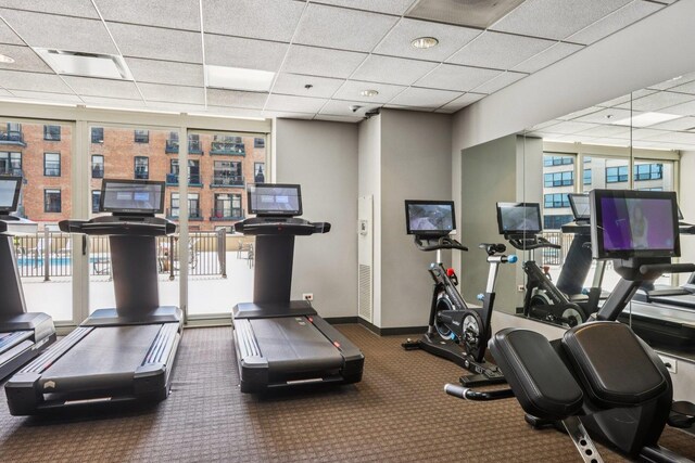 1111 S Wabash Ave Unit 1410, Chicago, IL 60605 - workout area featuring a paneled ceiling, plenty of natural light, baseboards, and carpet