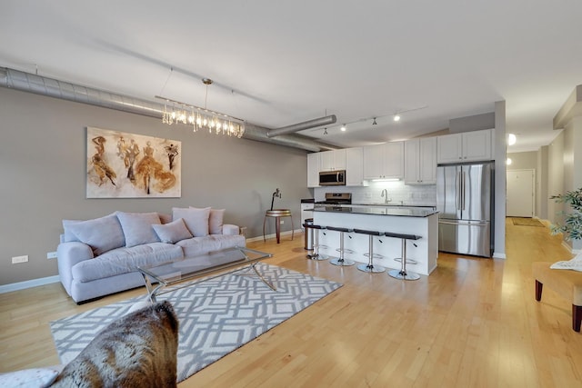 1200 W Monroe St Unit 514, Chicago, IL 60607 - living area with light wood-style floors and baseboards