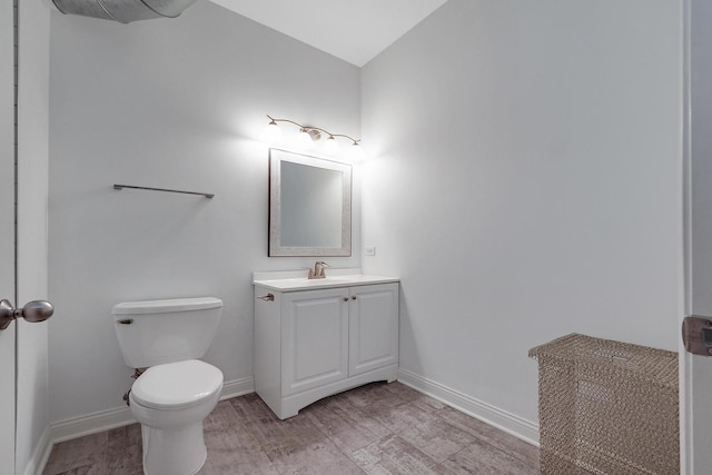 1200 W Monroe St Unit 514, Chicago, IL 60607 - bathroom with vanity, toilet, baseboards, and wood finished floors