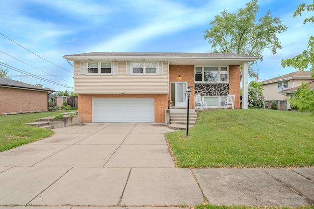 8106 W 89th Pl, Hickory Hills, IL 60457 - split foyer home with a garage, a front yard, brick siding, and driveway