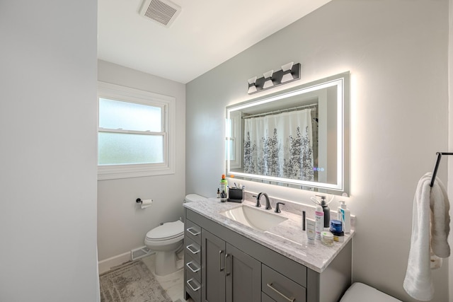 8106 W 89th Pl, Hickory Hills, IL 60457 - bathroom with toilet, vanity, and baseboards